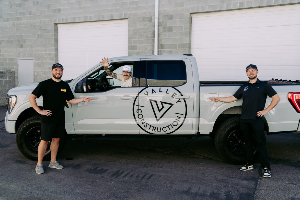 Valley Construction Team waiving from the Ford F-150 Photos